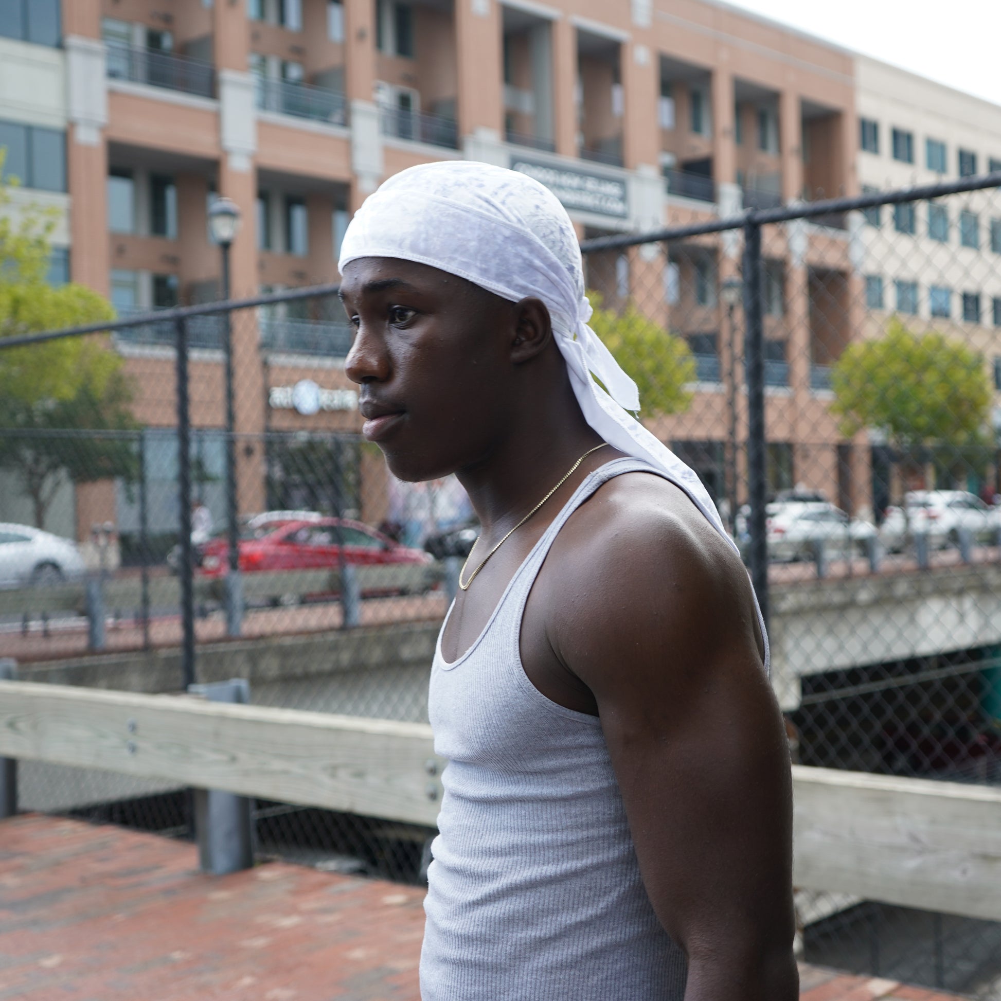 Profile view of model wearing crushed velvet durag