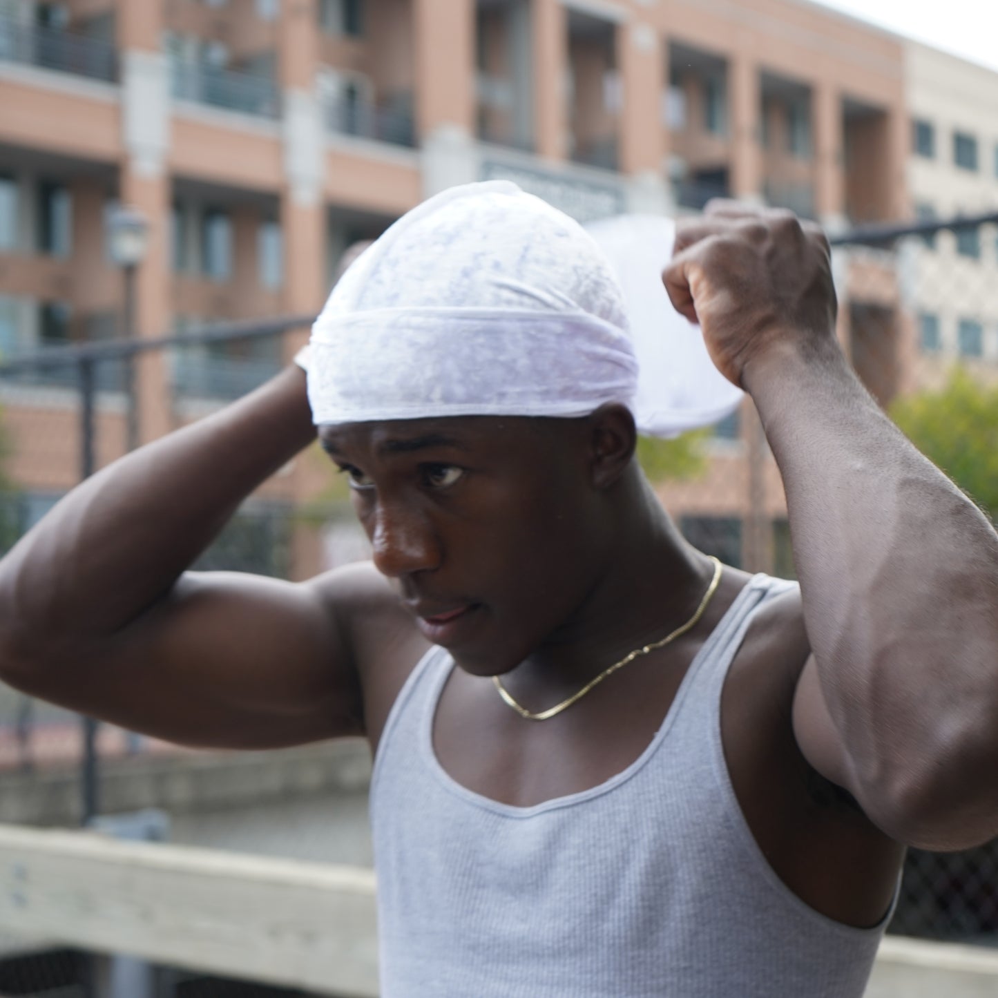 View of model tying velvet cloud durag