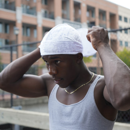 View of model tying velvet cloud durag